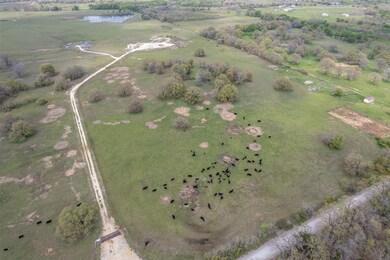Aerial view with a water view and a rural view