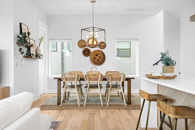Dining room featuring visible vents, baseboards, 