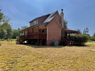 Back of house featuring central air condition unit