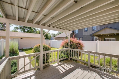 Wooden deck with a fenced backyard