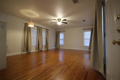 Unfurnished room with hardwood / wood-style floor