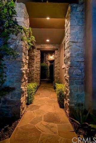 Walk through the private exterior courtyard toward