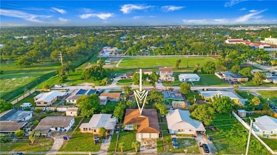 Aerial view of property's location featuring nearby suburban area