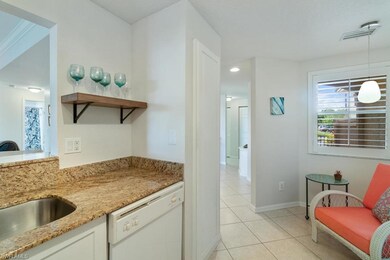 View from Kitchen to the Entry. Small seating area or 2 person table could be placed. Tall pantry door opens to pull out sliding shelves.