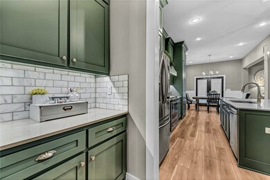 Butler's pantry adjacent to the kitchen and formal dining room
