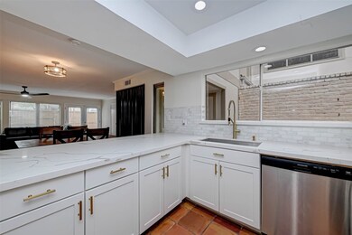The kitchen opens into the living area making it i