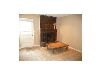 Family room with fireplace offers second living sp