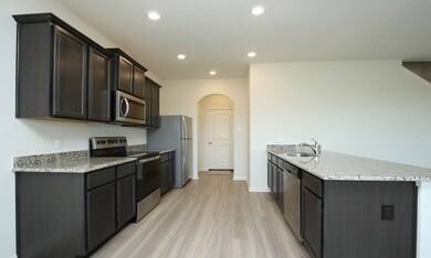 This move-in ready home includes many extras in the sales price, such as luxury plank flooring!