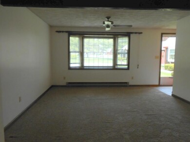 The living room is carpeted. Rough...
