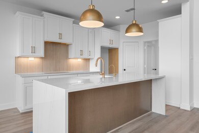 *REPRESENTATIONAL PHOTO* Designer-Inspired Kitchen Featuring Waterfall Island And Two Toned Cabinets
