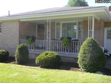 Relax on your covered front porch and watch the wo
