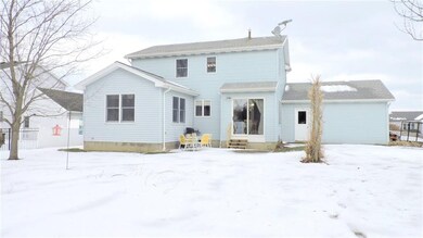 Rear yard boasts a brick paver patio, cherry tree,