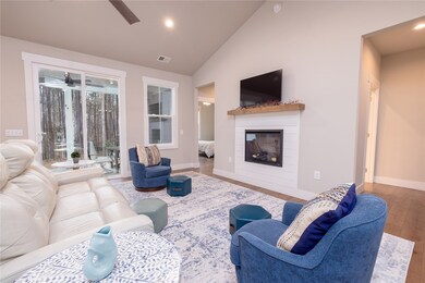 Living room doors open to covered outdoor porch