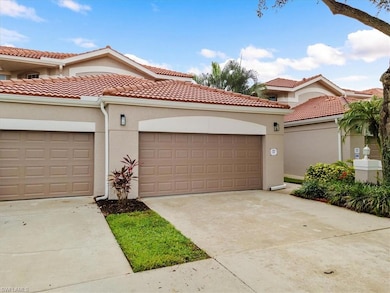 Mediterranean / spanish-style house with stucco siding, driveway, and a tiled roof