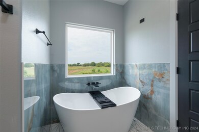Primary bath with marble surround.