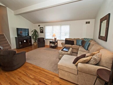 Crisp dcor with hardwood floors, vaulted ceilings,