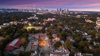 Aerial view of property's location with city skyl
