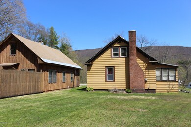 behind house & garage