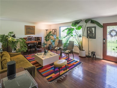 This living room is so large & has so much light c