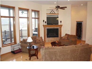 An Eye Catching Fireplace In The Spacious Living R