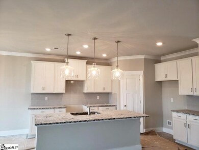 Granite, tile backsplash and stainless steel appli