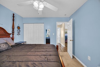 Bedroom with ceiling fan, baseboards, a closet, an