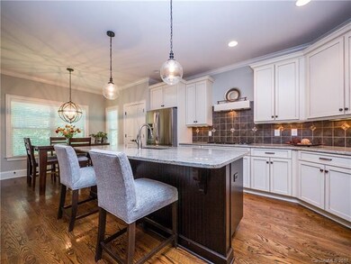 Impressive custom kitchen with spacious island bar