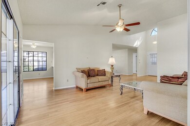Large living room with vaulted ceiling overlooking