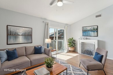Living room featuring visible vents, wood finishe