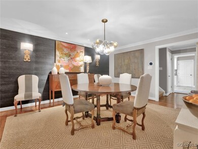 Beautiful dining room with wallpaper accent wall.