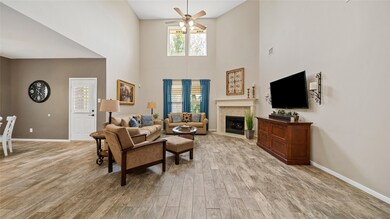 The living room with the two story ceiling and hard floors offers the wow factor!