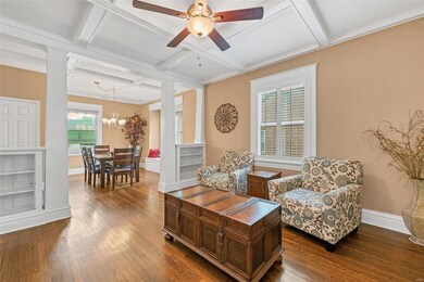 Look at those floors, built in bookshelves and coffered ceiling!