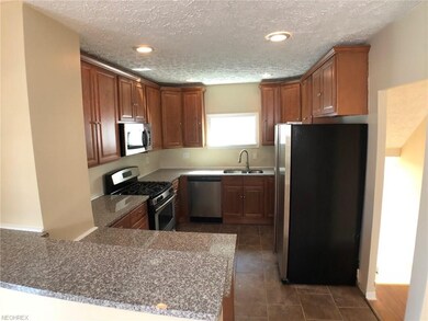 This kitchen has more than one entry and is partia