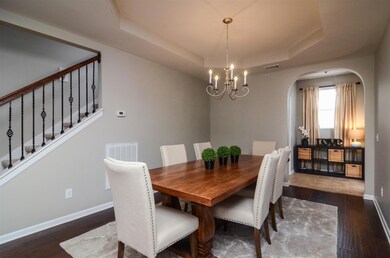Formal Dining is Open to Living Area.  Trey ceiling.  Hardwood Floors