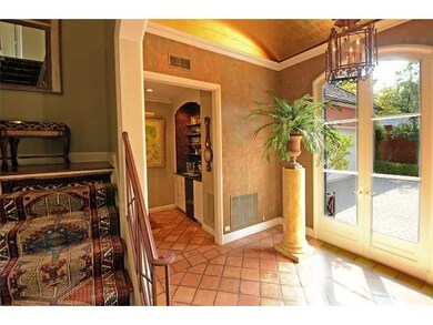 Entry leads to staircase, living room, and kitchen