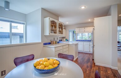 Across from Bedroom #1 is the kitchen with informal dining area.