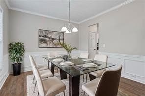 Dining area featuring dark wood-style flooring, or