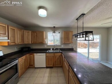 Kitchen featuring a wealth of natural light, white