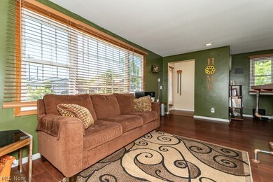 Living room featuring a wealth of natural light and wood-type flooring