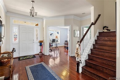 View into office from foyer, stairs tucked just of
