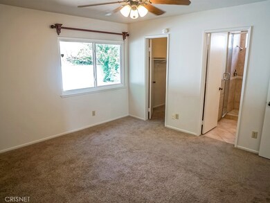 Master Bedroom - The carpet pictured here has been replaced with laminate flooring.