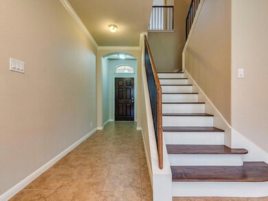Staircase featuring arched walkways, ornamental m