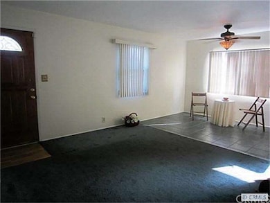 Freshly painted interior, ceiling fan over dining 