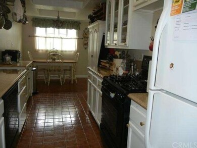 Beautiful custom counters, tiled flooring. Glass c