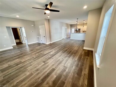 Long view of Open Floor Plan.  Kitchen is open to Dining Room area and Living room.