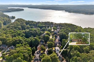 Aerial perspective of suburban area with a water and mountain view and property boundaries highlighted