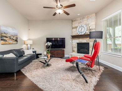 Living room with wood finished floors, a ceiling 
