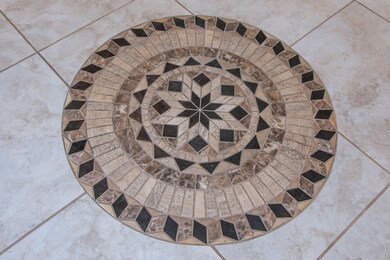 Mosaic tile design in entry