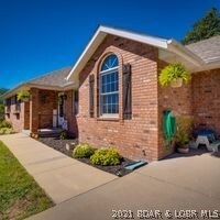 Brick front, sidewalk, landscaping
