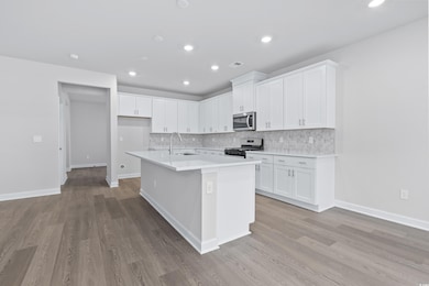Kitchen with stainless steel appliances, sink, a c